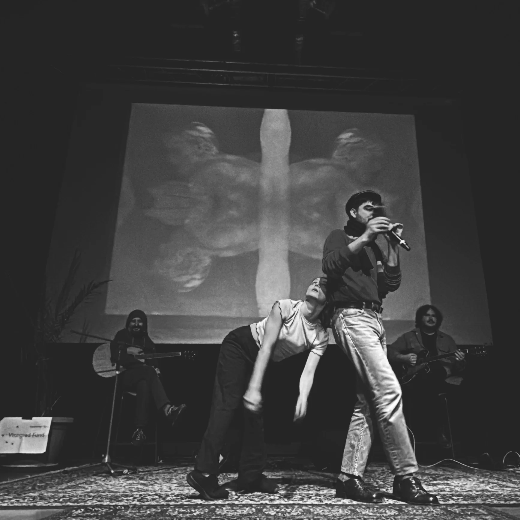 Tyko Say reading with Michaela Králiková w/ live projection of the Prague Tapes at Tabačka Kulturfabrik (January 2024) Photo by Katka Rybárová
