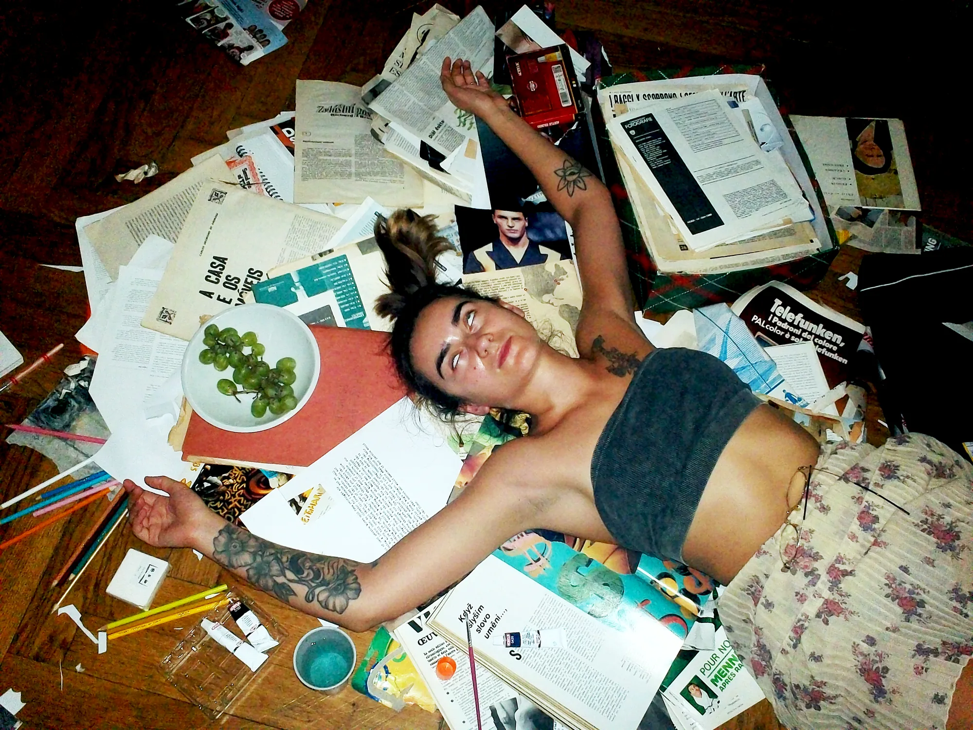 Sandra Pasławska on the editing floor, gluing together the latest copy of KROTCH Magazine